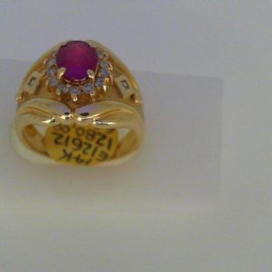 Ruby Estate Ring
14 Karat Yellow Ruby Ring With Finger Size 7.75
Width 2.9mm Gram Weight 6.7
1 Center Ruby 1.03ct Shape: Oval With 14 Round Diamonds 0.17 ctw