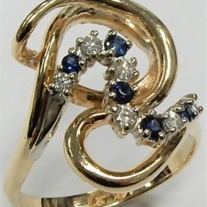 Diamond Estate Ring 
14 Karat Yellow/White Diamond Ring With Finger Size 8.5 
 Gram Weight 6.3 
 Center Diamond Shape: Round Round Sapphire 0.15 ctw