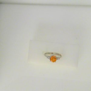 Sapphire Estate Ring
14 Karat White Orange Sapphire Ring With Finger Size 5
Gram Weight 2.3
1 Center Sapphire 1.30ct Shape: Round; Colour: Orange With 4 Round Sapphires