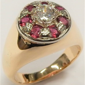 Diamond Estate Ring
14 Karat Yellow H Diamond Ring With Finger Size 8.25
Gram Weight 12.69
1 Center Diamond 0.65ct Shape: Round; Clarity: VS; Colour: H With 7 Round Rubies