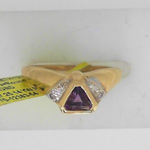 Amethyst Estate Ring
14 Karat Yellow/White Purple Amethyst Ring With Finger Size 7.25
Gram Weight 1.98
1 Center Amethyst Shape: Trillian; Colour: Purple With 2 Round Diamonds
