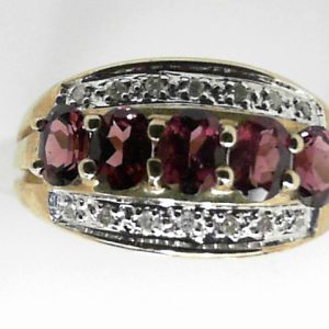 Garnets Estate Ring
8 Karat Yellow Garnets Ring With Finger Size 5
Gram Weight 2.1
5 Center Garnets Shape: Oval With 7 Round Diamonds
