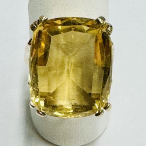 Citrine Estate Ring
10 Karat Yellow Orangy Yellow Citrine Ring With Finger Size 6.75
Gram Weight 7.66
1 Center Citrine 12.80ct Shape: Cushion; Colour: Orangy Yellow