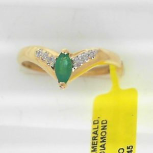 Emerald Estate Ring 
14 Karat Yellow Emerald Ring With Finger Size 8 
 Gram Weight 1.99 
1 Center Emerald Shape: Marquise With 6 Round Diamonds