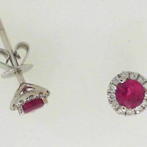 Earrings with Rubies
18 Karat White Rubies Earrings
Gram Weight 1.2
2 Center Rubies Shape: Round With 26 Round Diamonds 0.12 ctw