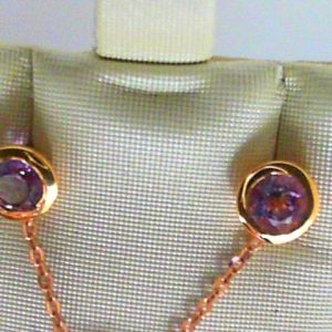 Earrings with Amethysts 
10 Karat Rosé Pink Amethysts Earrings 
 
2 Center Amethysts Shape: Round; Colour: Pink