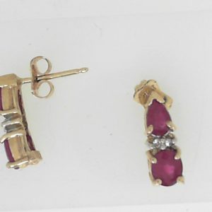 Estate Earrings With Rubies
10 Karat Yellow Rubies Earrings
Gram Weight 1.63
4 Center Rubies Shape: Various Shapes With 4 Round Diamonds