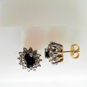 Estate Earrings With Sapphires
14 Karat Yellow/White Blue Sapphires Earrings
Gram Weight 3.8
2 Center Sapphires Shape: Oval; Colour: Blue With 48 Round Diamonds 0.33 ctw
