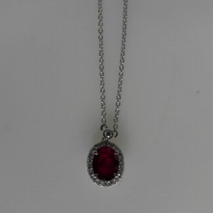 Diamonds Pendant
18 Karat White Diamonds Pendant
Chain Style: Open Link 18 Karat White
19 Center Diamonds Shape: Round With 1 Oval Ruby 1.53 ctw