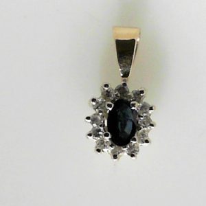 Sapphire Estate Pendant
14 Karat Yellow Blue Sapphire Pendant
Gram Weight 0.9 Chain Style: No Chain
1 Center Sapphire Shape: Oval; Colour: Blue With 12 Round Diamonds
