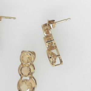 Citrines Estate Pendant
14 Karat Yellow Citrines Pendant
Gram Weight 3.05 Chain Style: No Chain
9 Center Citrines Shape: Round