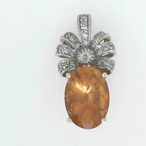 Citrine Estate Pendant
14 Karat Yellow/White Citrine Pendant
Gram Weight 3.9 Chain Style: No Chain
1 Center Citrine Shape: Oval With 20 Round Diamonds
