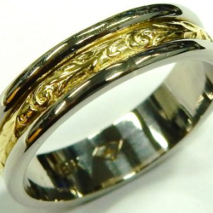 Yellow/White 18 Karat Polished Band Estate Ring
Size: 6.25
Gram Weight 4.2 gr