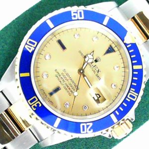 Estate Rolex Divers Year: 2001
Vendor Style #: 001-22393-001 Serti Champagne SN: K882076 Bracelet
40mm 18K/Stainless Steel
Dial: Champagne diamonds sapphires 
Box Not Included/Papers Not Included
Condition Very good
1 Year Warranty