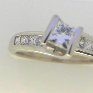 Diamond Engagement Ring 
14 Karat White Engagement Ring 1twt
Finger Size 6.25 Gram Weight 4gram weight Width: 2.2 
1 Center Diamond 0.50ct Shape: Princess With 8 Princess Diamonds 0.50 ctw 1