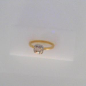 Diamond Engagement Ring 
14 Karat Yellow/White Engagement Ring 0.6twt
Finger Size 6.5 
1 Center Diamond 0.50ct Shape: Round Clarity: SI2 Colour: O/P Round Diamond 0.10 ctw 0.6