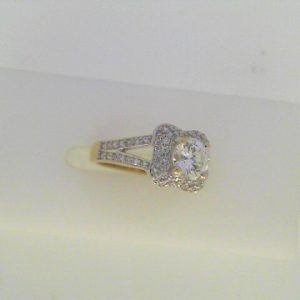 Diamond Engagement Ring 
18 Karat White Engagement Ring 0.71twt
Finger Size 3 Gram Weight 3.2gram weight Width: 2 
1 Center Diamond 0.49ct Shape: Round Clarity: SI1 Colour: G With 72 Round Diamonds 0.22 ctw 0.71