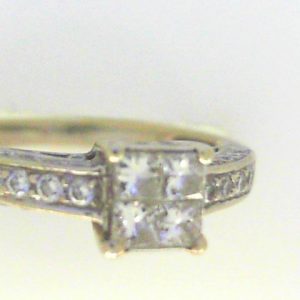 Estate Diamond Engagement Ring 
18 Karat White Estate Engagement Ring 
 Gram Weight 3.8 
4 Center Diamonds Shape: Princess; Clarity: SI1; Colour: I With 10 Round Diamonds 0.16 ctw and 34 Round Diamonds Round Diamond 0.60 ctw and 24 Round Diamonds 0.14