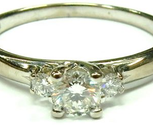 Estate Diamond Engagement Ring
18 Karat White Estate Engagement Ring Width 1.7mm
Finger Size 8 Gram Weight 3.2
1 Center Diamond Shape: Round; Clarity: I1; Colour: I Maple Leaf With 2 Round Diamonds 0.09 ctw 0.09