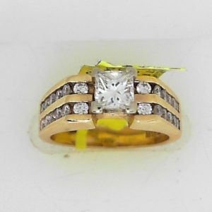 Estate Diamond Engagement Ring 
14 Karat Yellow/White Estate Engagement Ring 
Finger Size 5.75 Gram Weight 6.4 
1 Center Diamond 0.55ct Shape: Princess; Clarity: SI1; Colour: G With 24 Round Diamonds 0.50 ctw 1.05