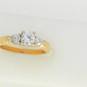 Estate Diamond Engagement Ring 
14 Karat Yellow/White Estate Engagement Ring 
Finger Size 5 Gram Weight 2.6 
1 Center Diamond 0.30ct Shape: Round; Clarity: VS2; Colour: I With 2 Pear Diamonds 0.16 ctw 0.46