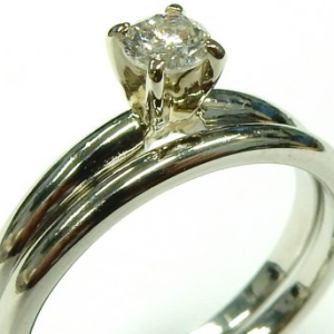 Estate Diamond Engagement Ring 
Platinum White Estate Engagement Ring 
Finger Size 7 Gram Weight 6.1 
1 Center Diamond 0.20ct Shape: Round; Clarity: I1; Colour: K 0.2