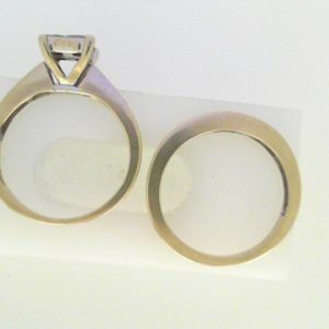 Estate Diamond Engagement Ring
14 Karat White Estate Engagement Ring
Finger Size 7.25 Gram Weight 6
4 Center Diamonds Shape: Princess; Clarity: SI-I1; Colour: I With 19 Round Diamonds 0.50 ctw 1