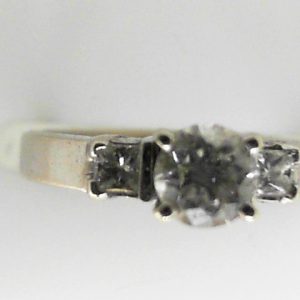 Estate Diamond Engagement Ring 
18 Karat White Estate Engagement Ring 
Finger Size 4 Gram Weight 4 
1 Center Diamond 0.50ct Shape: Round; Clarity: SI2; Colour: F With 2 Round Diamonds 0.16 ctw 0.66