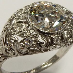 Estate Diamond Engagement Ring 
Platinum White Estate Engagement Ring Width 11.8mm 
Finger Size 5.5 Gram Weight 5.1 
1 Center Diamond 1.96ct Shape: EURO Cut; Clarity: VS1; Colour: G Round Diamond 1.96