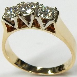 Estate Diamond Engagement Ring 
14 Karat Yellow/White Estate Engagement Ring Width 4mm 
Finger Size 7 Gram Weight 3.9 
3 Center Diamonds Shape: Round; Clarity: VS; Colour: G/H 0.75