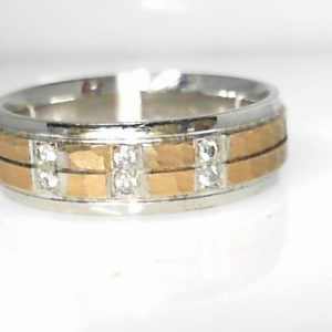 Diamond Ring- Men's 
10 Karat Yellow/White Men's Diamond Ring 
Finger Size 10 Gram Weight 7.62 
 Center Diamond Shape: Round