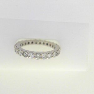 Diamond Wedding/Anniversary Ring 
18 Karat White Wedding/Anniversary Ring Width 2.5mm 
Finger Size 6 
25 Center Diamonds Shape: Round; Clarity: SI1; Colour: I 1.7