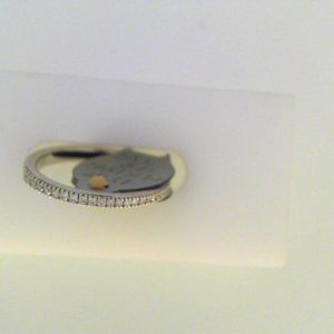 Diamond Wedding/Anniversary Ring 
18 Karat White Wedding/Anniversary Ring 
Finger Size 6 
 Center Diamond Shape: Round; Clarity: VS1; Colour: F/G 0.18