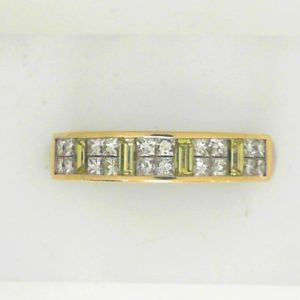 Diamond Wedding/Anniversary Ring 
18 Karat Yellow/White Wedding/Anniversary Ring 
Finger Size 6 
20 Center Diamonds Shape: Princess; Clarity: SI1; Colour: F/G With 4 Baguette Diamonds 0.33 ctw 0.88