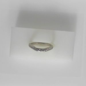 Estate Diamond Anniversary Ring 
14 Karat White Estate Anniversary Ring 
Finger Size 5 Gram Weight 2.41 
30 Center Diamonds Shape: Round; Clarity: VS; Colour: G/H 0.15