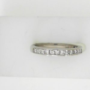 Estate Diamond Anniversary Ring 
14 Karat White Estate Anniversary Ring 
 Gram Weight 2.4 
17 Center Diamonds Shape: Round; Clarity: SI; Colour: H 0.75