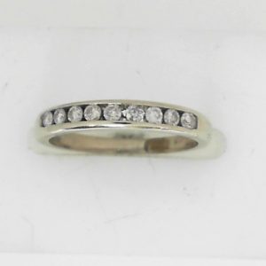 Estate Diamond Anniversary Ring 
14 Karat White Estate Anniversary Ring 
Finger Size 4.75 Gram Weight 1.8 
9 Center Diamonds Shape: Round; Clarity: I1; Colour: I 0.2