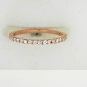 Estate Diamond Anniversary Ring 
10 Karat Rosé Estate Anniversary Ring 
Finger Size 4.75 Gram Weight 0.8 
22 Center Diamonds Shape: Round; Clarity: I1; Colour: I 0.15