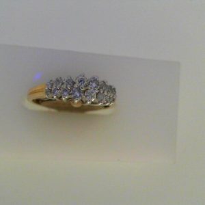 Diamond Dinner Ring - Women's 
14 Karat Yellow/White Dinner Ring Width 1.75mm 
Finger Size 5.75 Gram Weight 2.7 
16 Center Diamonds Shape: Round 0.36