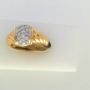 Diamond Dinner Ring - Women's 
14 Karat Yellow Dinner Ring 
Finger Size 6.5 
19 Center Diamonds 0.35ct Shape: Round Clarity: SI1 Colour: G/H 0.29