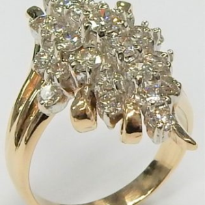 Estate Diamond Dinner Ring - Women's 
14 Karat Yellow/White Estate Dinner Ring Width 3.3mm 
Finger Size 7 Gram Weight 8.7 
27 Center Diamonds Shape: Round; Clarity: SI1; Colour: J/K 1.86