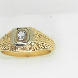 Estate Diamond Dinner Ring - Women's 
14 Karat Yellow/White Estate Dinner Ring 
Finger Size 6.5 Gram Weight 5.3 
 Center Diamond Shape: Round; Clarity: I1; Colour: H/I 0.08