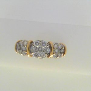 Estate Diamond Dinner Ring - Women's 
14 Karat Yellow/White Estate Dinner Ring Width 2.7mm 
Finger Size 10 Gram Weight 4.7 
21 Center Diamonds Shape: Round; Clarity: I1; Colour: I/J 1