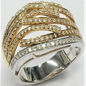 Estate Diamond Dinner Ring - Women's 
14 Karat Yellow/White Estate Dinner Ring 
Finger Size 7 Gram Weight 7.3 
 Center Diamond Shape: Round; Clarity: SI2; Colour: I/J 0.75