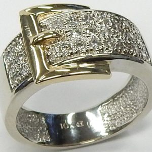 Estate Diamond Dinner Ring - Women's 
10 Karat Yellow/White Estate Dinner Ring Width 8mm 
Finger Size 6.5 Gram Weight 5.74 
26 Center Diamonds Shape: Round; Clarity: I2; Colour: I/J 0.33