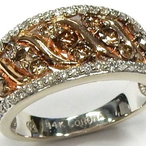 Estate Diamond Dinner Ring - Women's 
14 Karat Rose/White Estate Dinner Ring 
Finger Size 6.5 Gram Weight 4.9 
19 Center Diamonds Shape: Round With 40 Round Diamonds 0.50 ctw 1