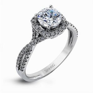 Diamond Semi-Mount Ring 
18 Karat White Ring 
Finger Size 7 
 Center Diamond Shape: Round; Clarity: VS1; Colour: F/G 0.29