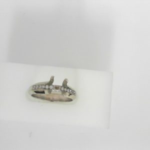 Estate Diamond Semi-Mount
14 Karat White Estate Semi-Mount Ring
Finger Size 6.75 Gram Weight 4.5
12 Center Diamonds Shape: Round; Clarity: VS; Colour: G/H 0.15