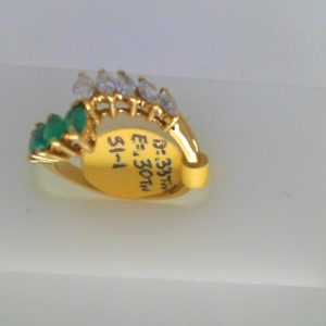 Emeralds Estate Ring 
18 Karat Yellow Emeralds Ring With Finger Size 5.25 
Width 2mm Gram Weight 3.3 
5 Center Emeralds Shape: Marquise With 5 Marquise Diamonds 0.33 ctw