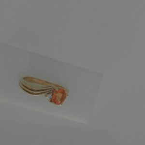 Diamond Estate Ring 
14 Karat Yellow Diamond Ring With Finger Size 7.25 
 
1 Center Diamond Shape: Round With 1 Oval Sapphire